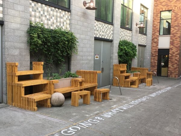 Installed and treated alley benches and movable furniture.
